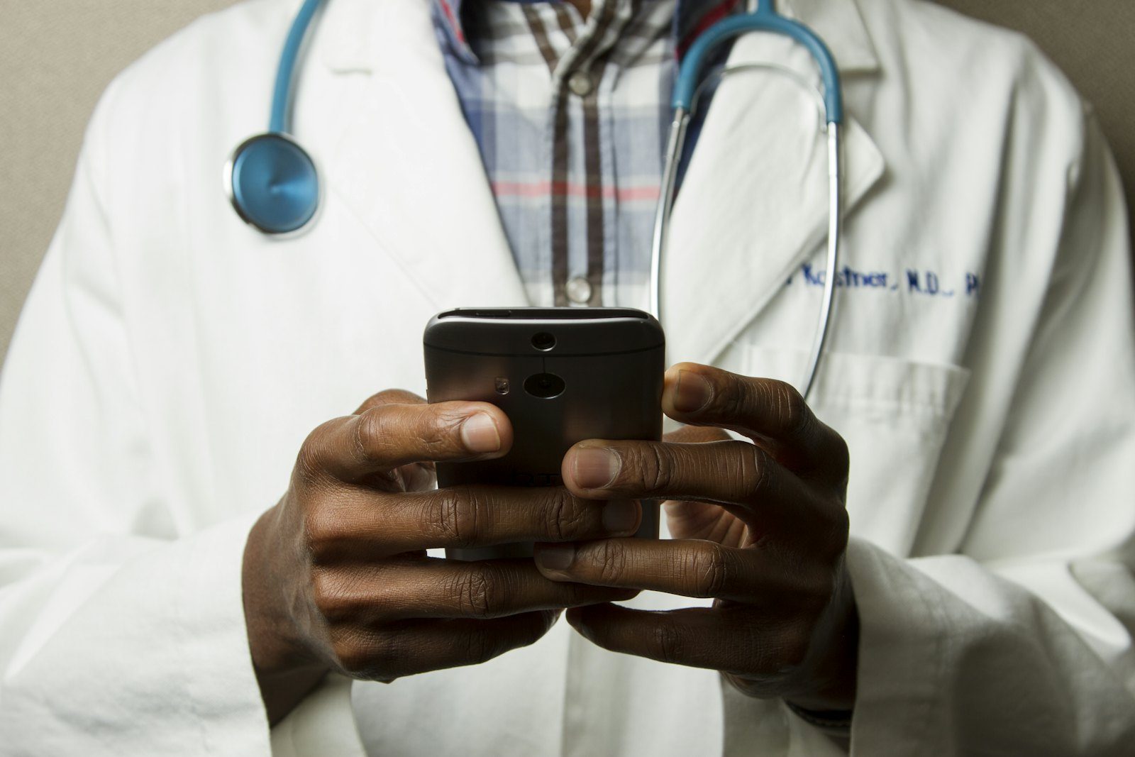 Clinician reviewing notes in a consulting room