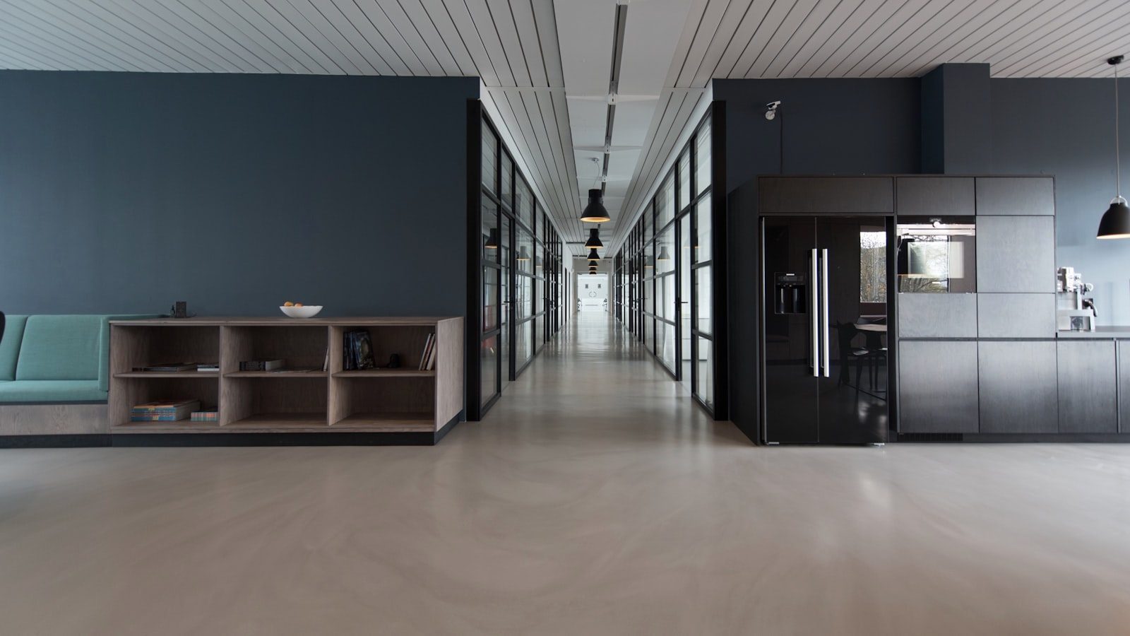Bright open-plan office with desks, screens and meeting space